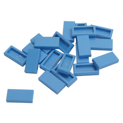 LEGO Tile 1 x 2 part 3069 with smooth rectangular top and recessed underside medium blue