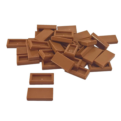 LEGO Tile 1 x 2 part 3069 with smooth rectangular top and recessed underside medium nougat