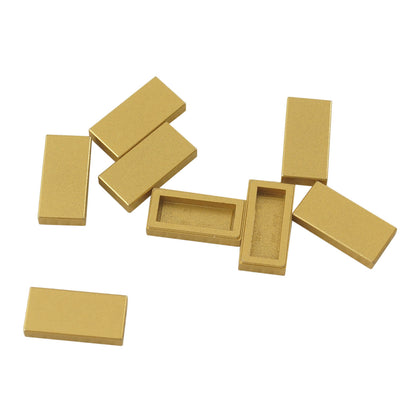 LEGO Tile 1 x 2 part 3069 with smooth rectangular top and recessed undersidemettalic gold