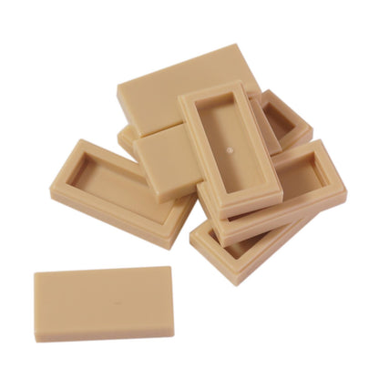 LEGO Tile 1 x 2 part 3069 with smooth rectangular top and recessed underside tan