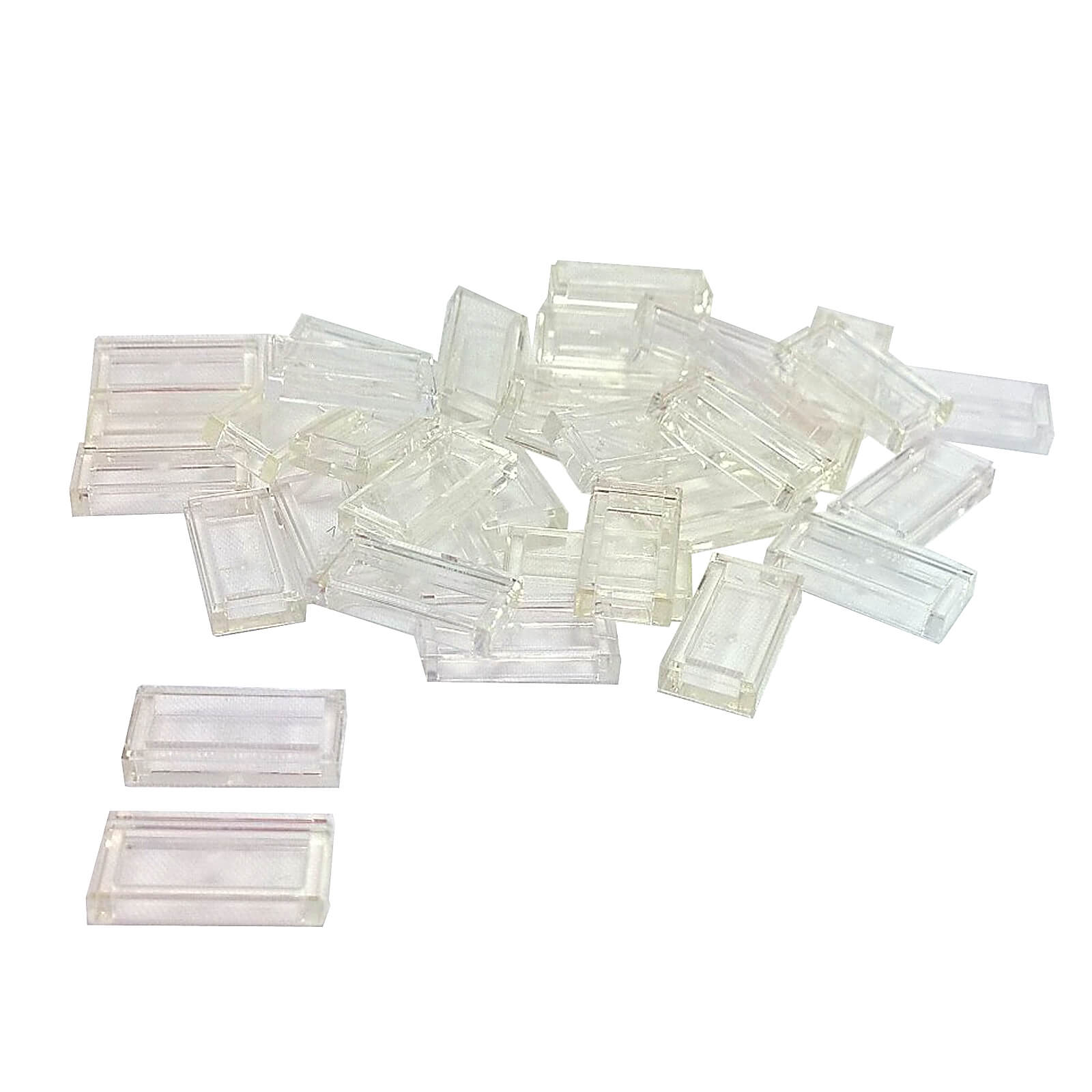 LEGO Tile 1 x 2 part 3069 with smooth rectangular top and recessed underside trans-clear
