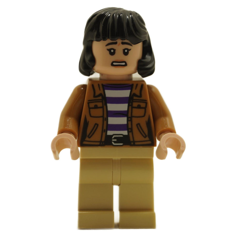 LEGO® Yasmina "Yaz" Fadoula Minifigure – Detailed figure featuring a medium nougat jacket, purple and white striped shirt, and tan legs, inspired by Jurassic World Camp Cretaceous and Chaos Theory. Perfect for building iconic Jurassic adventures.