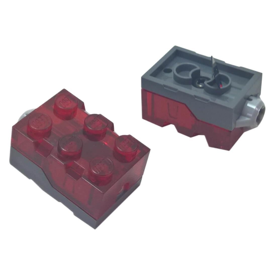 Close-up of a LEGO Light Brick (54930c01) on a dark grey base with a metal contact tab - red light