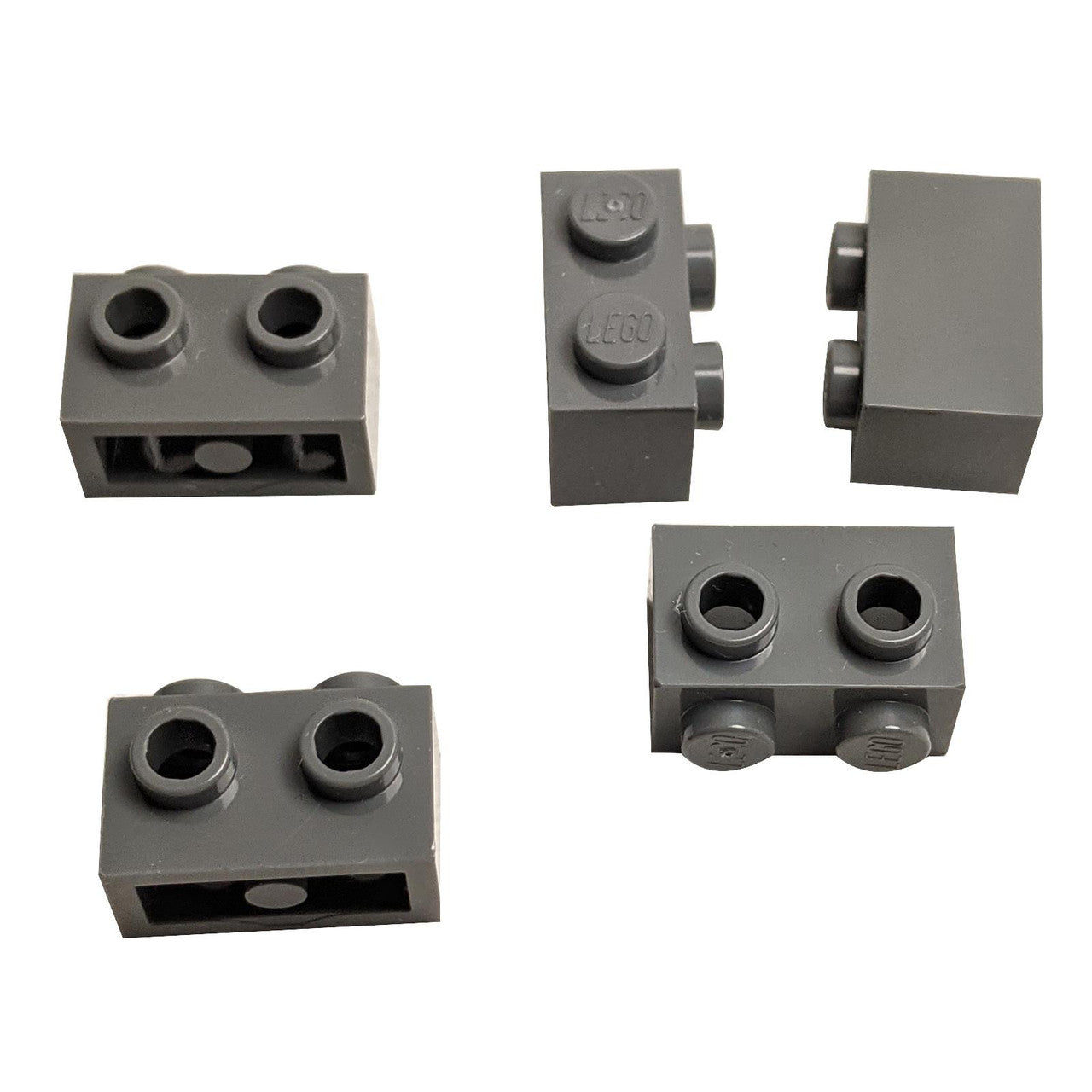 Five dark gray modified 1 x 2 bricks 11211 from various angles.