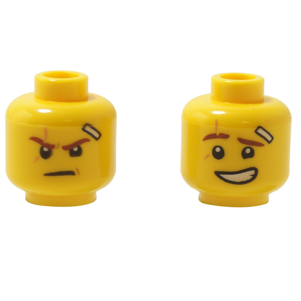 Dual-sided minifigure head with facial scar, bandage detail, and a lopsided grin expression