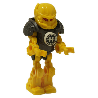 LEGO® Hero Factory Mini – Evo (hf017) front view, featuring yellow armor with black chest plate and Hero Factory emblem, red visor, and detailed mechanical limbs. Displayed on a white background.  