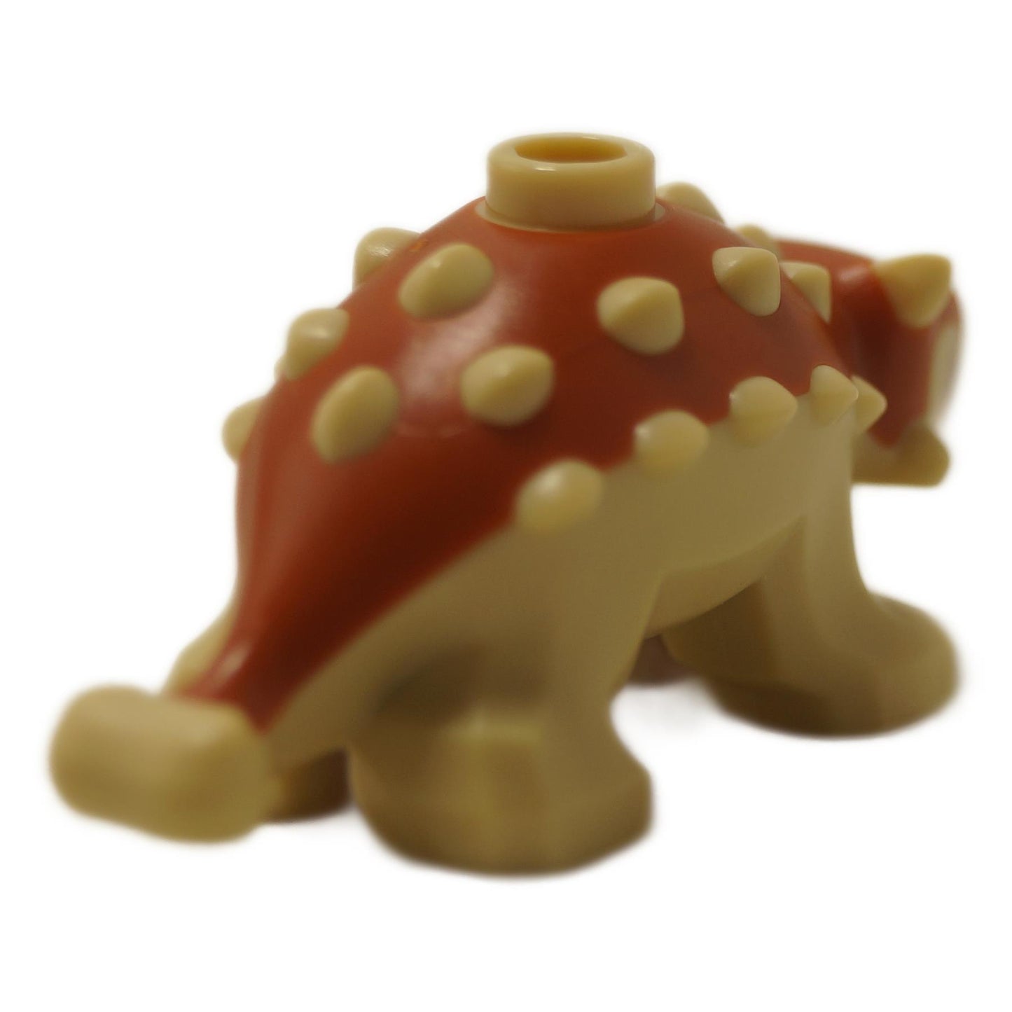 Baby Ankylosaurus Dinosaurfigur mit dunkelorangefarbenen Rückendetails und passenden Augen, kleines geformtes Kreaturenteil, Rückansicht.