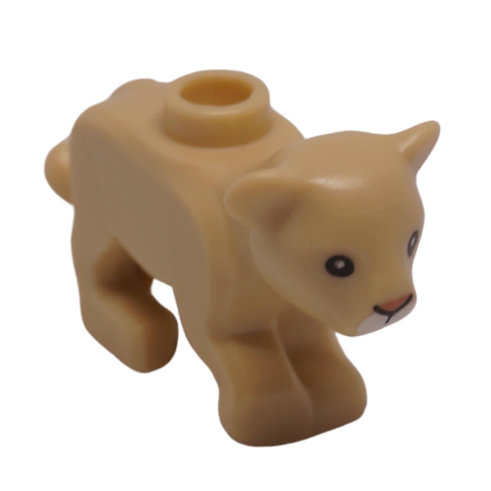 Large baby cat cub figure nougat color with black eyes and white muzzle front view
