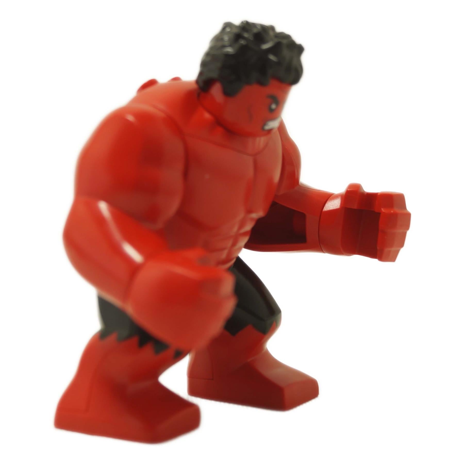 Side view of the large red LEGO Red Hulk figure in an aggressive stance.