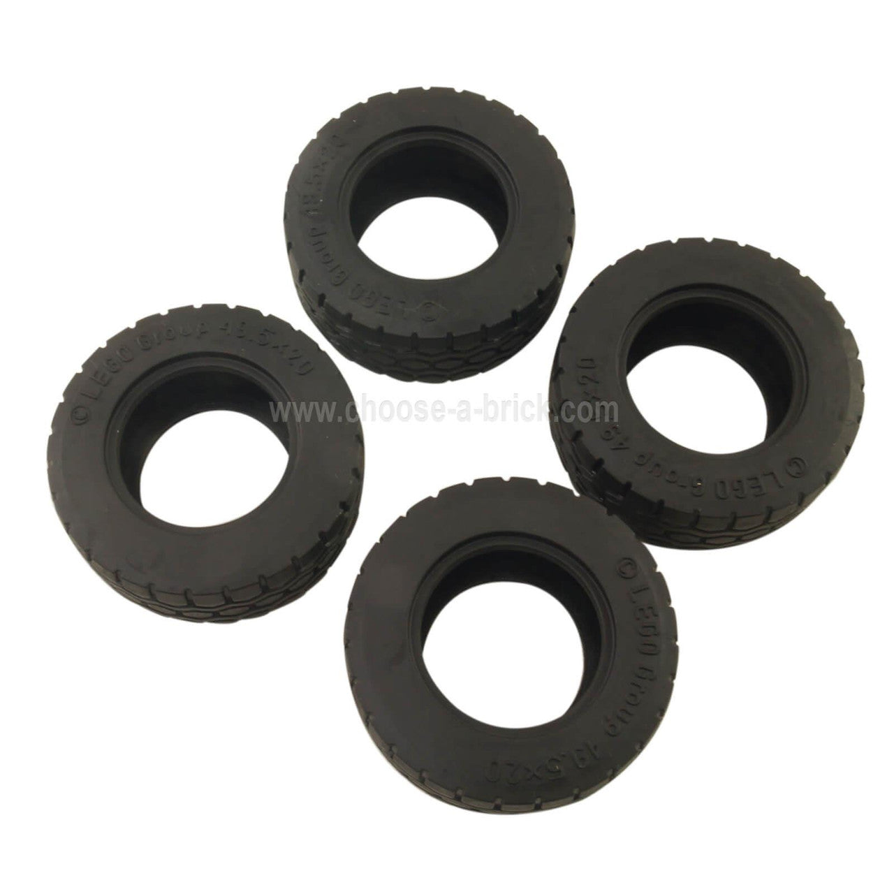 Four LEGO Black Tires 49.5 x 20, top view.