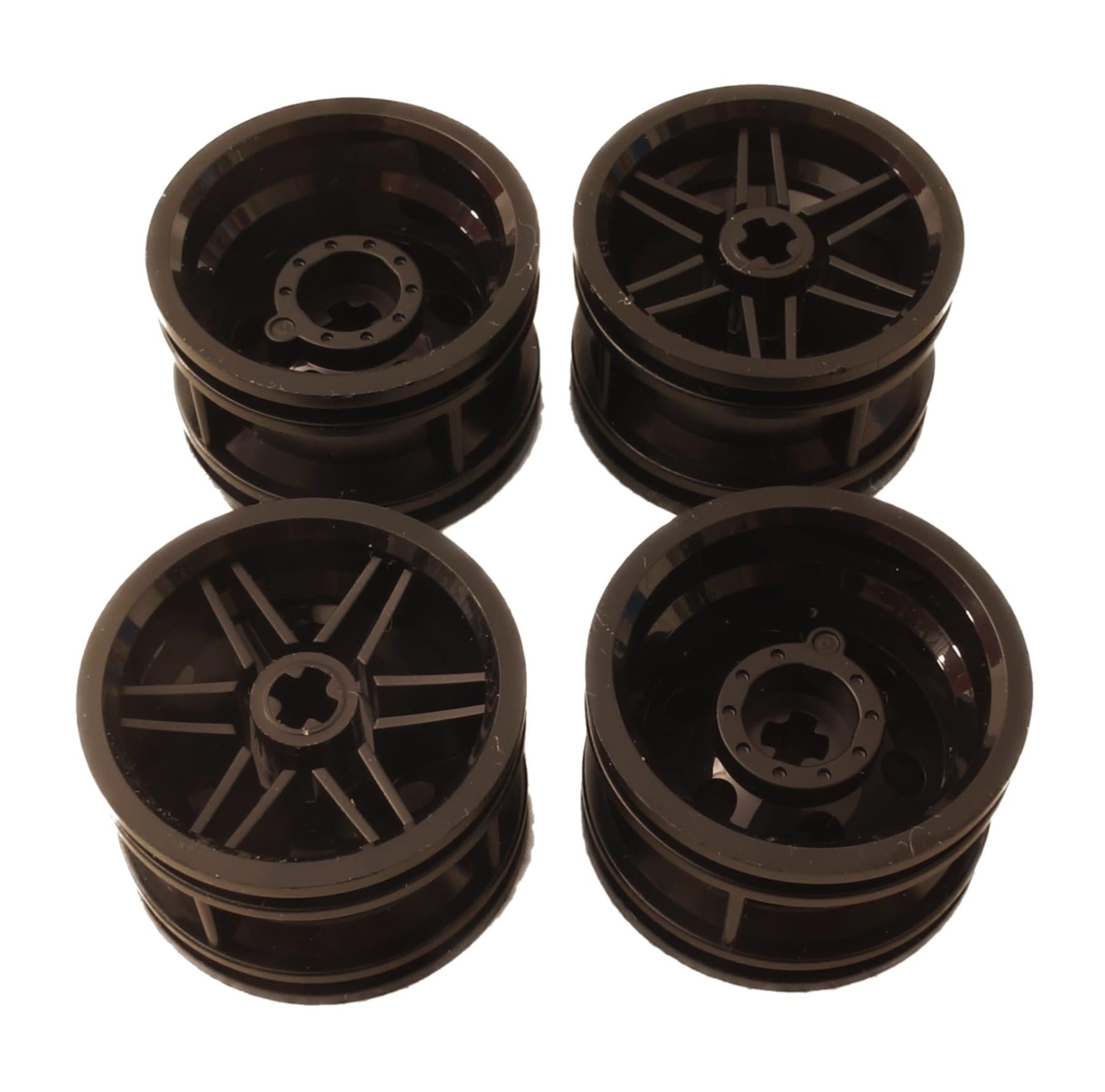 LEGO® wheel 30.4 mm diameter x 20 mm wide with reinforced rim and no pin holes, suitable for vehicles and Technic-style builds, black color