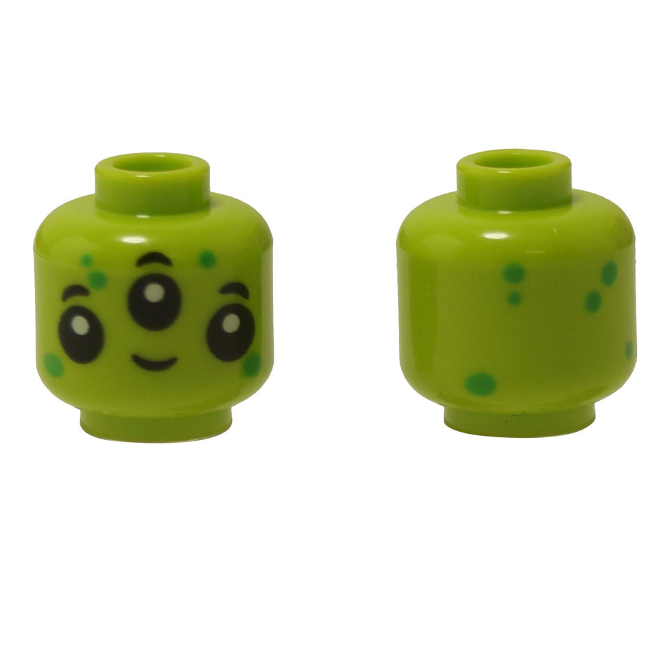 Front and alternate side views of the LEGO® minifigure head (3626pb3540) in bright lime green, featuring a cute alien face with three large black eyes and green dot markings across the head.