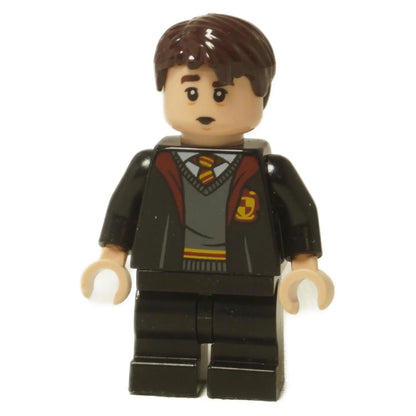 LEGO® Minifigura de Harry Potter Neville Longbottom (hp330) con túnicas de Gryffindor, mostrando su cabeza de doble cara con expresiones de sonrisa y preocupación sobre un fondo blanco.