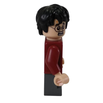 Side view of the LEGO® Harry Potter™ minifigure (hp143) showing alternate surprised facial expression and red plaid shirt sleeve.