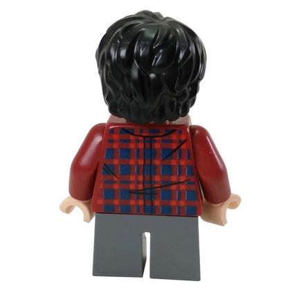 Rear view of the LEGO® Harry Potter™ minifigure (hp143) showing black tousled hair and dark red plaid shirt with back print detail.
