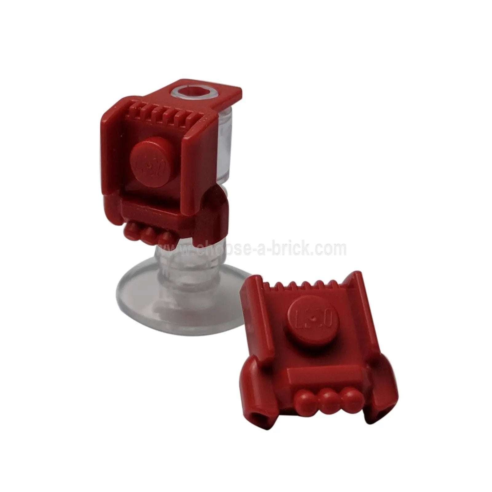 Two red LEGO minifigure jetpack/harness elements (58017). One is mounted on a clear minifigure stand.