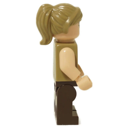 Side profile of the LEGO® Jurassic World Zora Bennett minifigure (jw135) showing the light tan arm color and brown ponytail hairpiece.