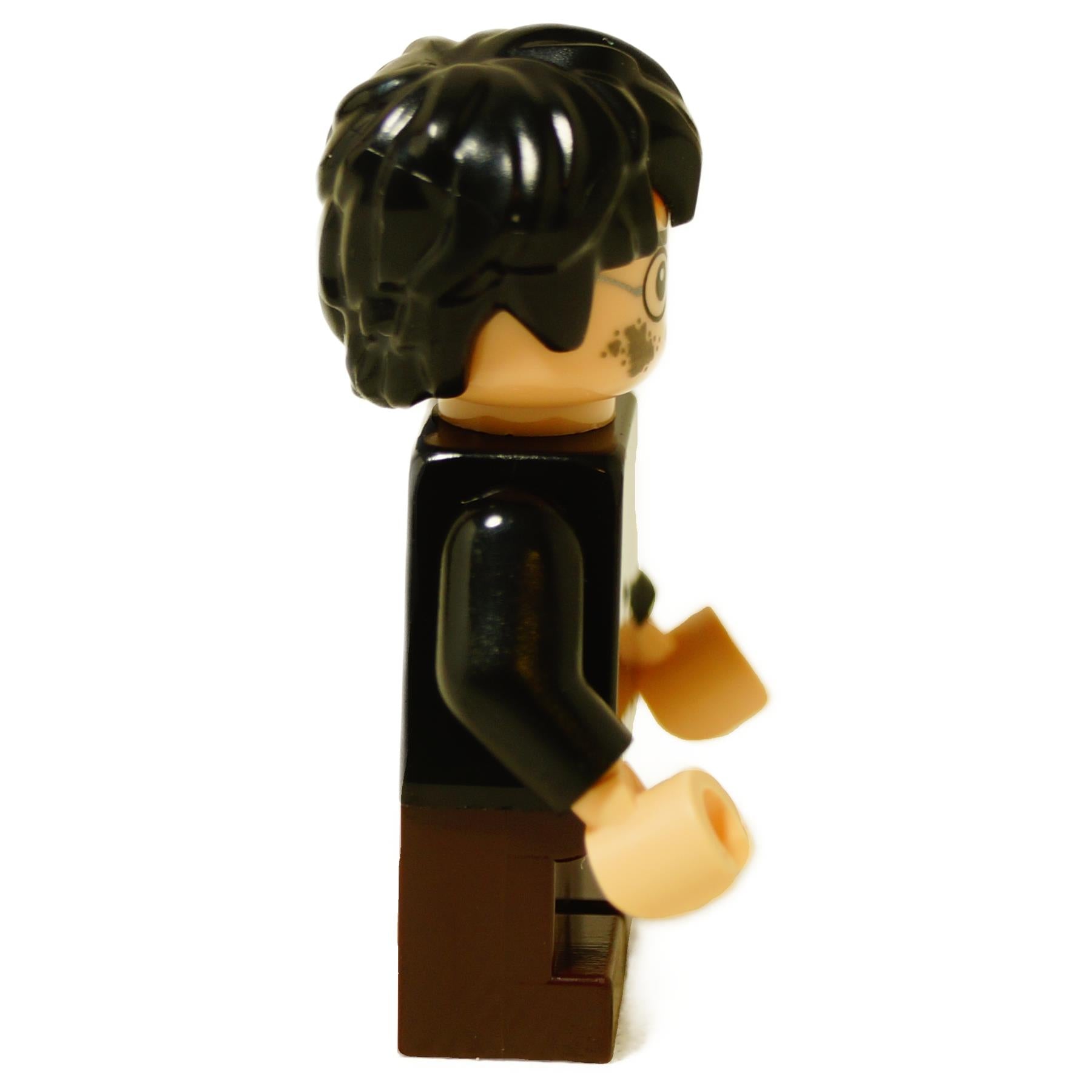 Side view of LEGO Harry Potter minifigure showing black messy hair and black robe shoulders.
