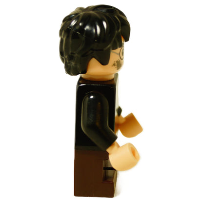 Side view of LEGO Harry Potter minifigure showing black messy hair and black robe shoulders.