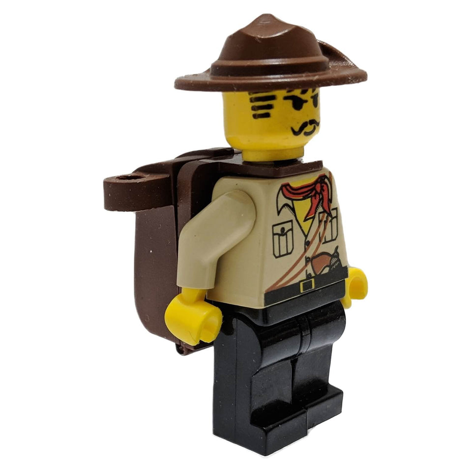 LEGO® Johnny Thunder minifigure with tan shirt, red neckerchief, printed harness and badge, black legs, brown wide-brim hat, and a brown backpack.