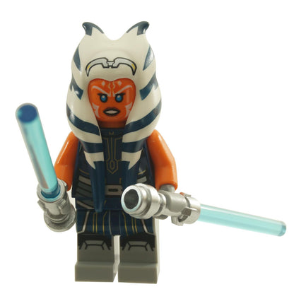 Ahsoka Tano adult minifigure wearing a dark blue jumpsuit, holding two light blue lightsabers
