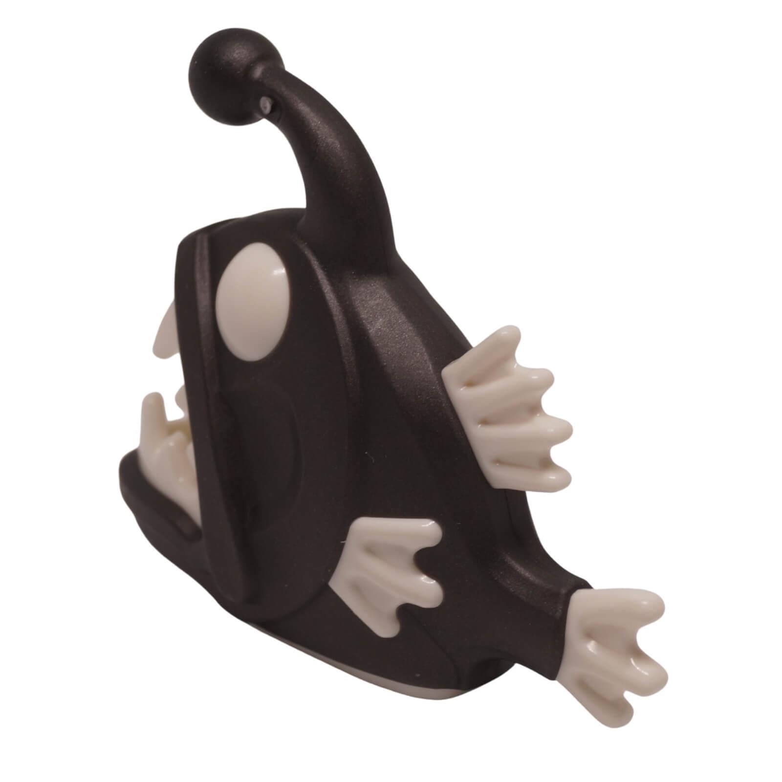 Black LEGO anglerfish figure with molded white eyes, white fins, and sharp white teeth pattern (Part 67471pb02) rear view