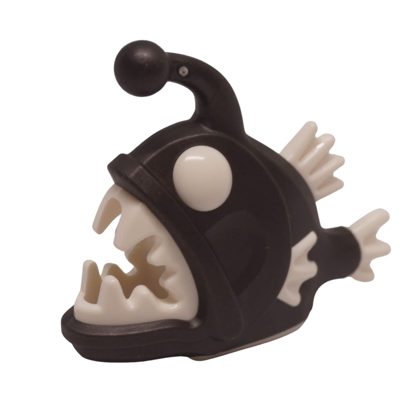 Black LEGO anglerfish figure with molded white eyes, white fins, and sharp white teeth pattern (Part 67471pb02).