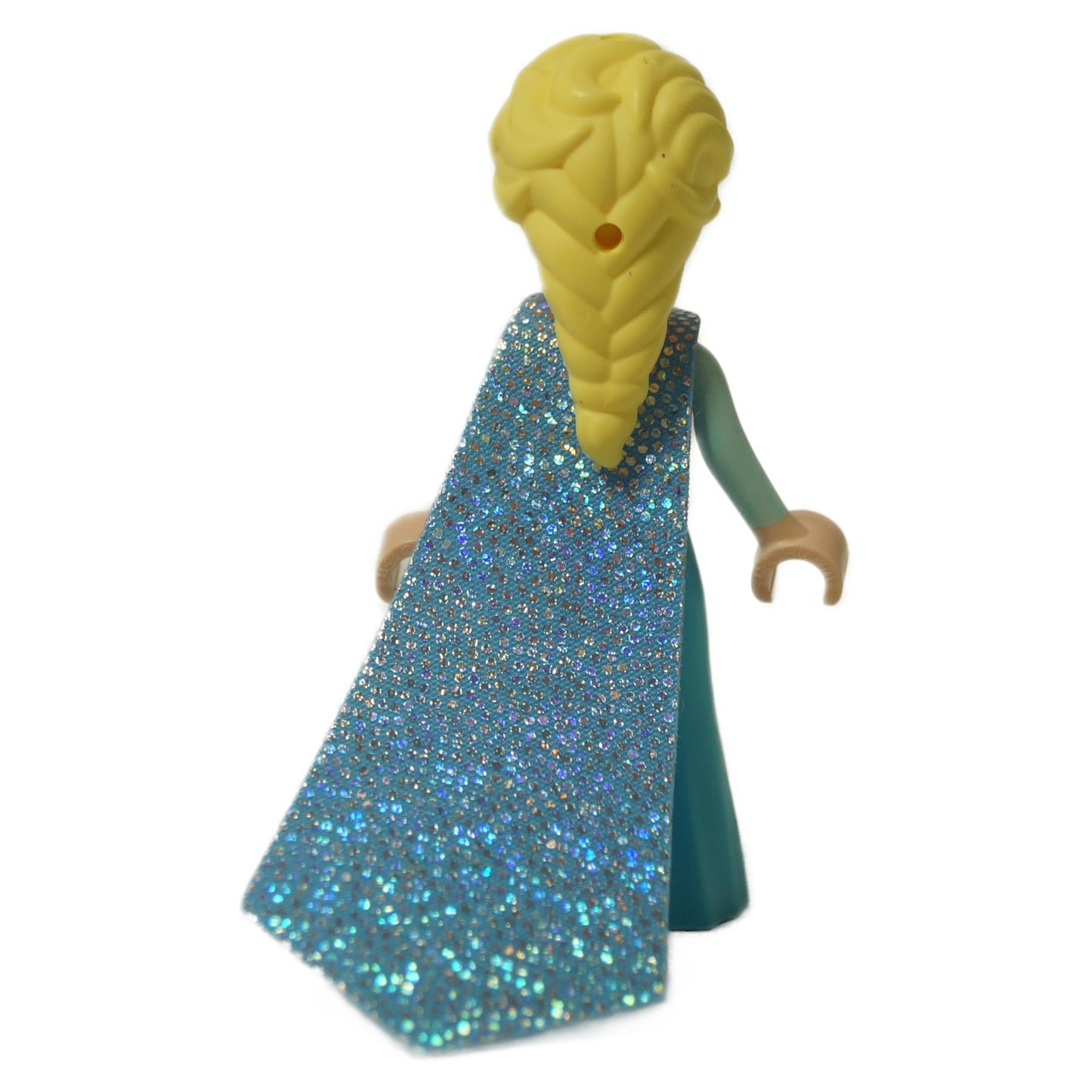 Back view of LEGO Elsa mini-doll displaying her long, glittery blue fabric cape attached to her turquoise and silver dress.