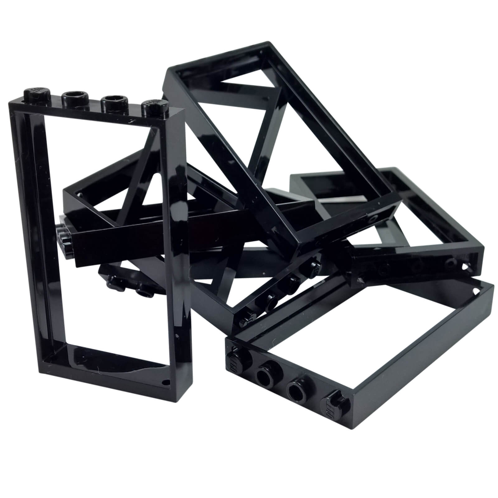 Pile of black LEGO Door Frame 1x4x6 Type 2 pieces (60596) showing studded tops and open construction.