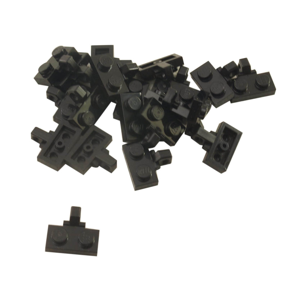 Black hinge plate 1x2 locking with 1 finger on the side, without bottom groove for hinged connections.
