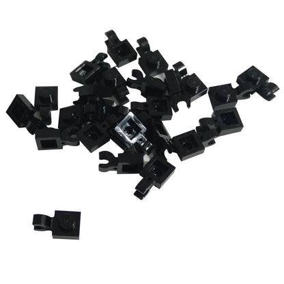 Black LEGO® modified plate 1 x 1 part 61252 shown from two angles with single stud and open horizontal O clip