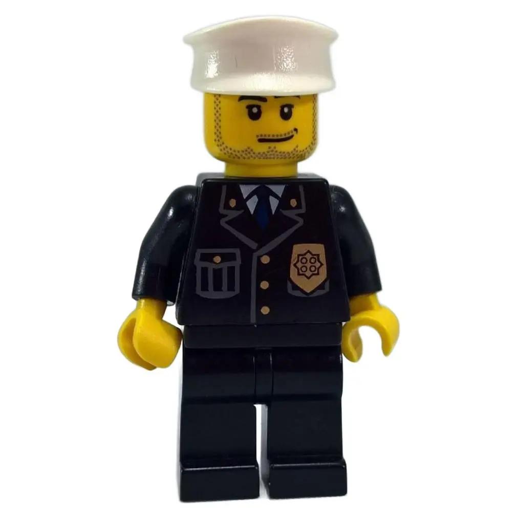 Black police officer minifigure with white hat, blue tie suit, badge print and stubble beard face
