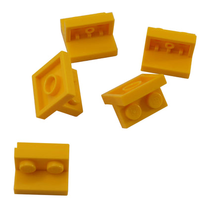 Yellow LEGO Bracket 2 x 2 - 1 x 2 Centered part 41682 shown from front and rear angles