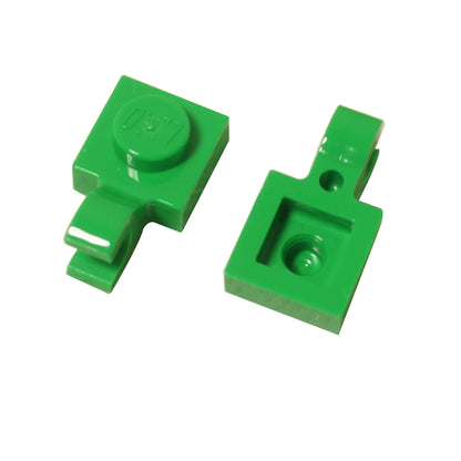 Bright green LEGO® modified plate 1 x 1 part 61252 shown from two angles with single stud and open horizontal O clip