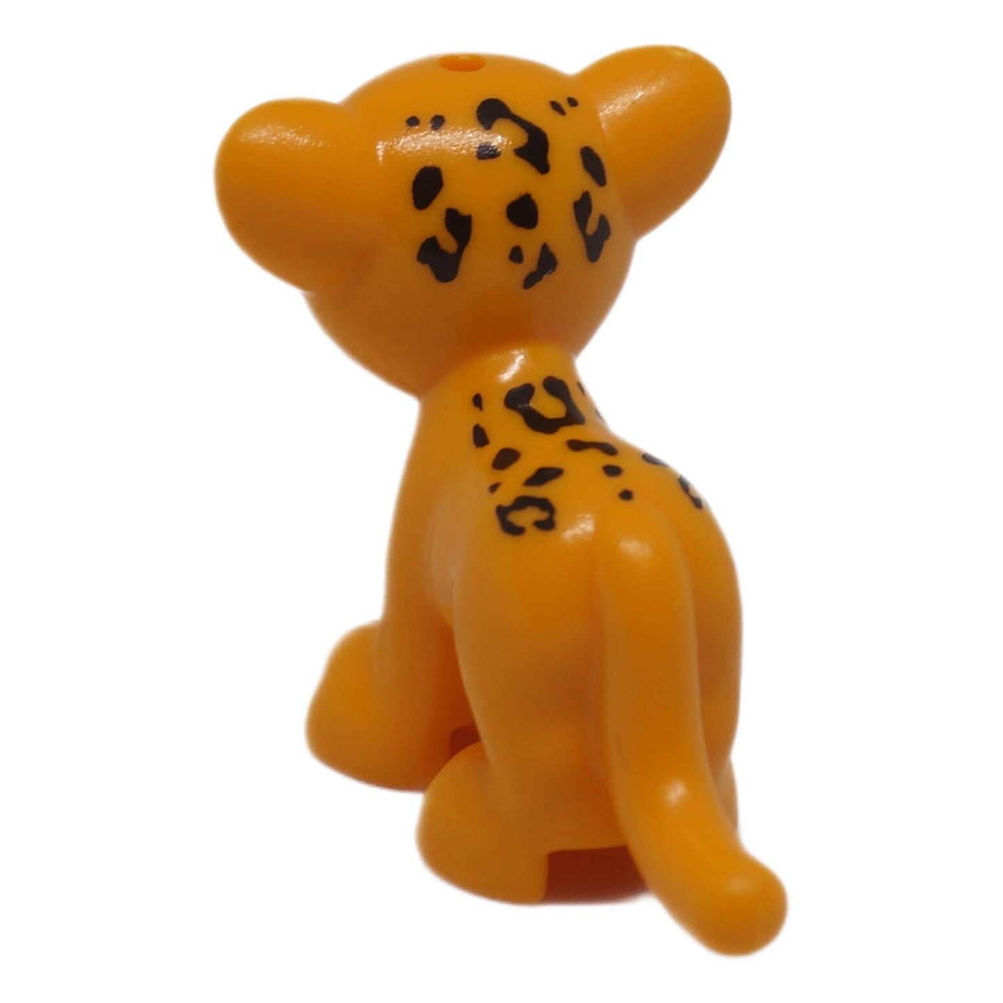 Bright light orange jaguar cub with black rosettes, rear back view small animal figure
