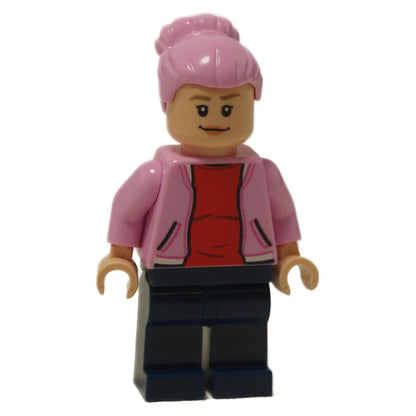 Brooklynn minifigure with confident smile expression, pink hair bun, pink jacket, red shirt and dark blue legs
