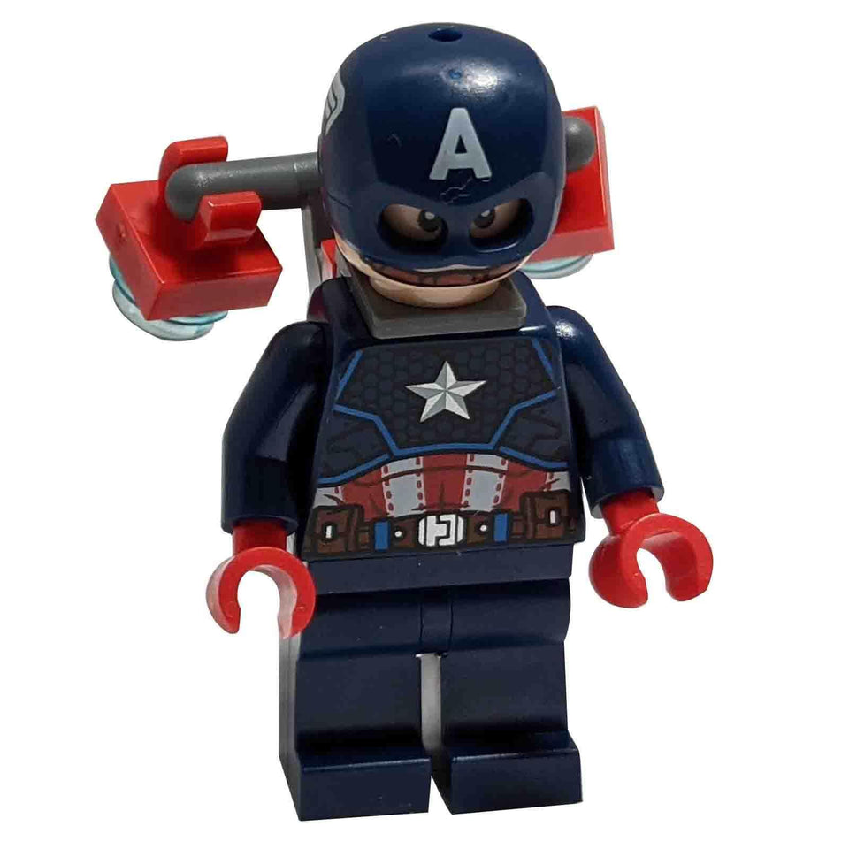 A LEGO® minifigure of Captain America in a dark blue suit with a white star on the chest, red and white belt details, a dark blue helmet with a white 'A', red hands, and a red and dark bluish grey jet pack, against a white background.