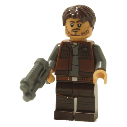 Cassian Andor minifigure wearing reddish brown vest, holding blaster, dark brown legs and stubble face
