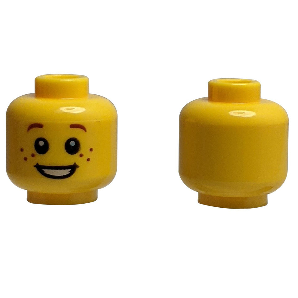 Front and back of yellow LEGO head 3626cpb0471 with freckles and a smile.