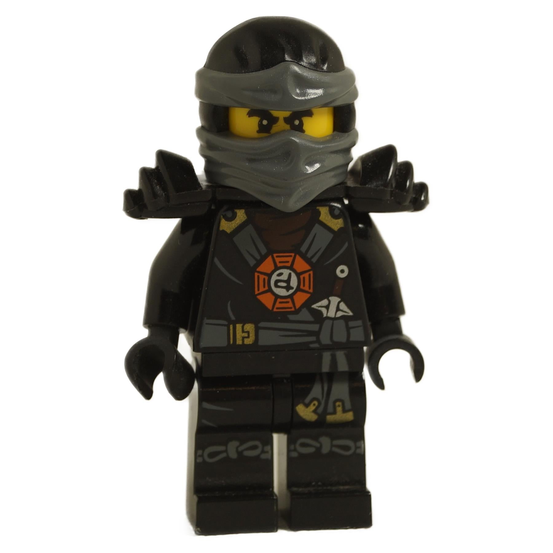 LEGO minifigure of a ninja character with black armor and a round emblem on the chest, wearing a dark gray ninja mask.