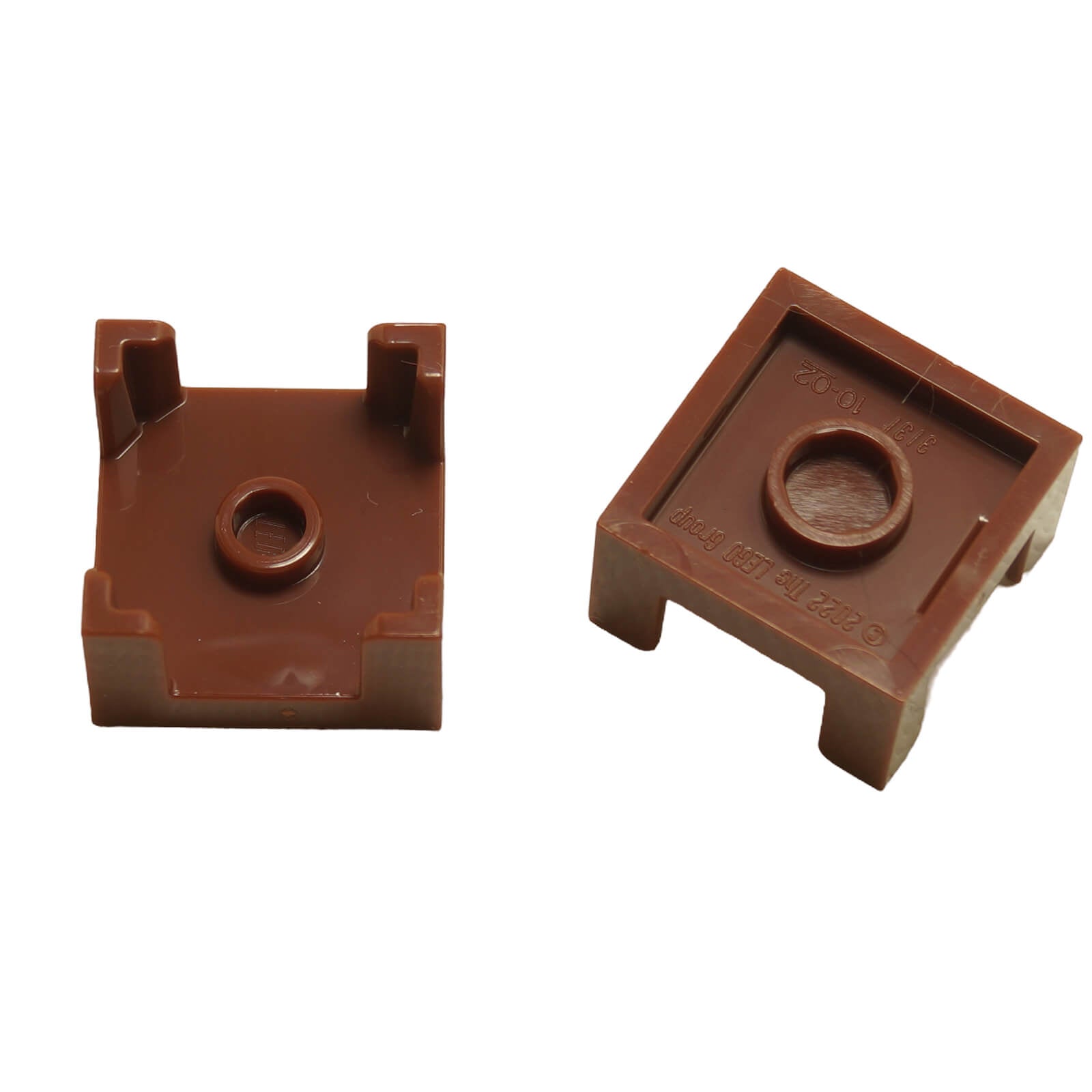 Two Reddish Brown LEGO® 2x2x1 Half Container Box parts (3131), showing top and bottom connection points for stacking.