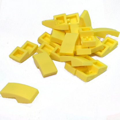 LEGO Curved Slope 2 x 1 x 2/3 part 11477 shown from top and underside bright light yellow