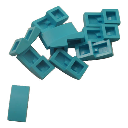 LEGO Curved Slope 2 x 1 x 2/3 part 11477 shown from top and underside dark turquoise