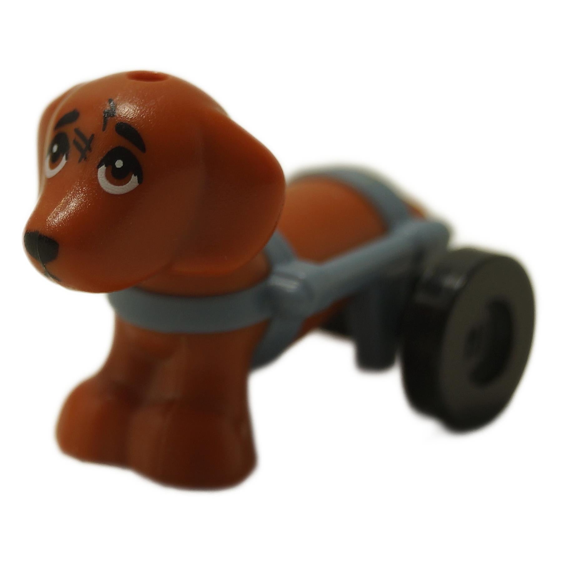Dachshund dog figure with wheelchair harness and black wheels, shown from front angle
