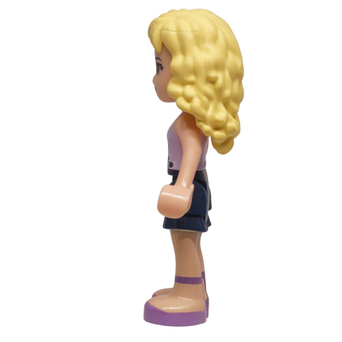 LEGO Friends Danielle mini-doll frnd0049 with lavender floral top, layered skirt, and bow hairpiece. From Downtown Bakery set, ideal for collections. Side profile