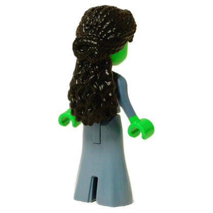Rear view of the LEGO® Elphaba mini-doll (wck004) showing long dark wavy hair and sand blue dress with subtle back detailing.