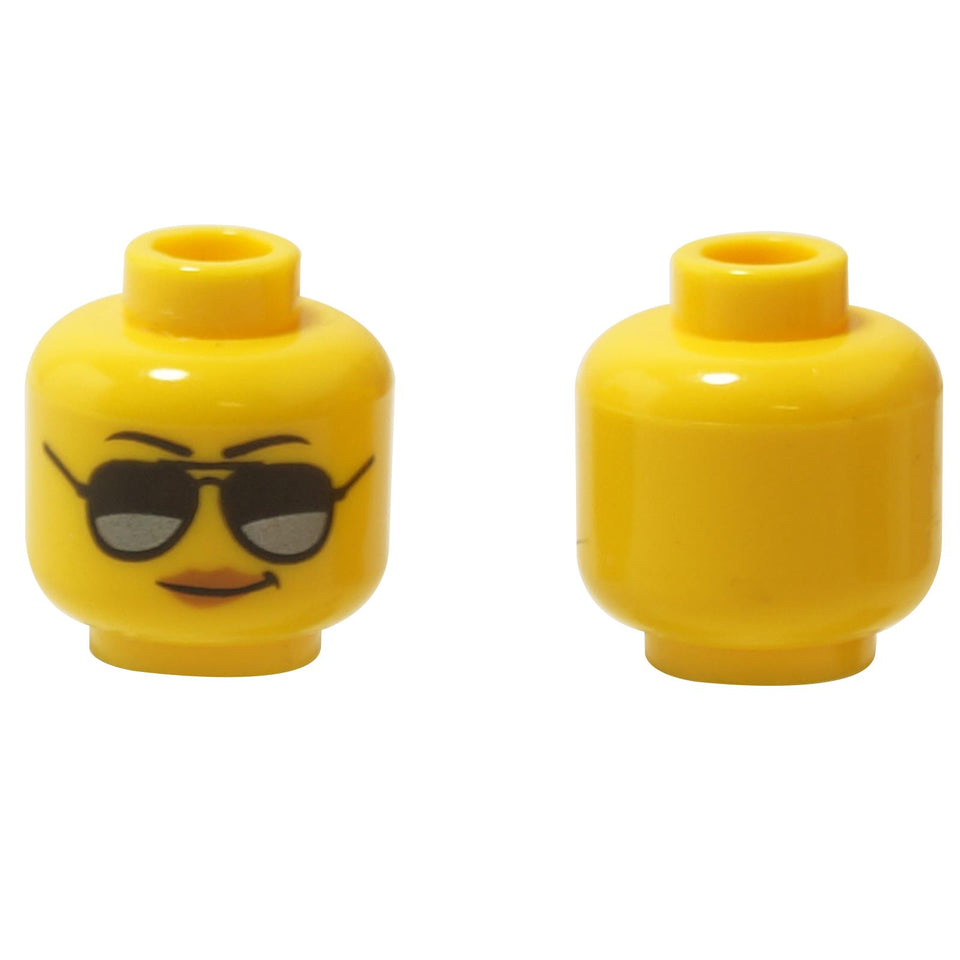 Vorder- und Rückansicht des LEGO® weiblichen Minifigurenkopfs (3626pb1778) in Gelb, mit schwarzen Augenbrauen, dunkelsilbernen Sonnenbrillen und Lippen in mittlerem Nougat-Farbton.