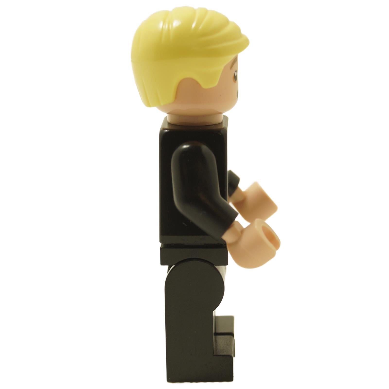 Side view of LEGO® Harry Potter Draco Malfoy minifigure hp412 wearing a black suit with Slythe
