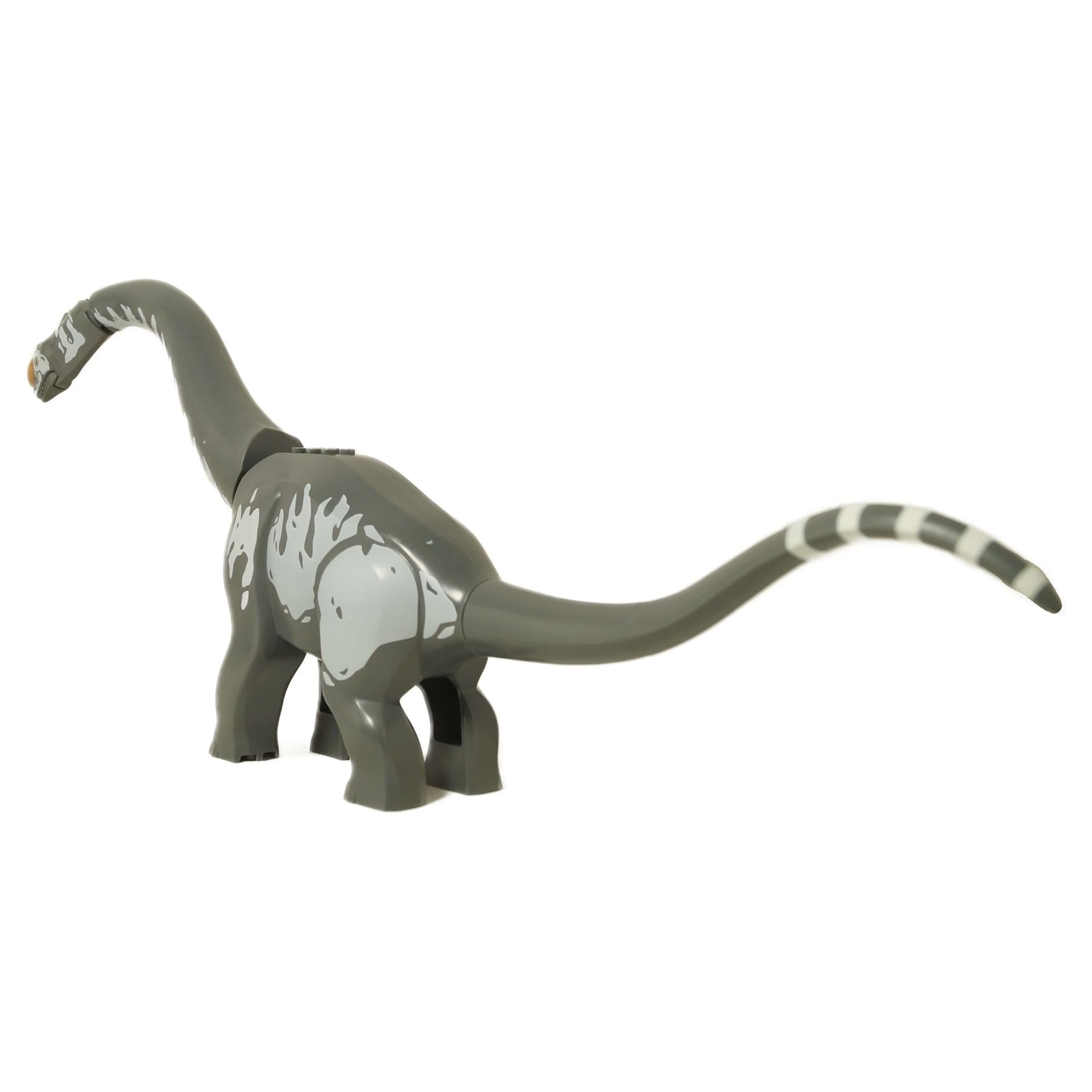 Angled side view of the LEGO Titanosaurus, highlighting the grey body stripes and striped tail tip.