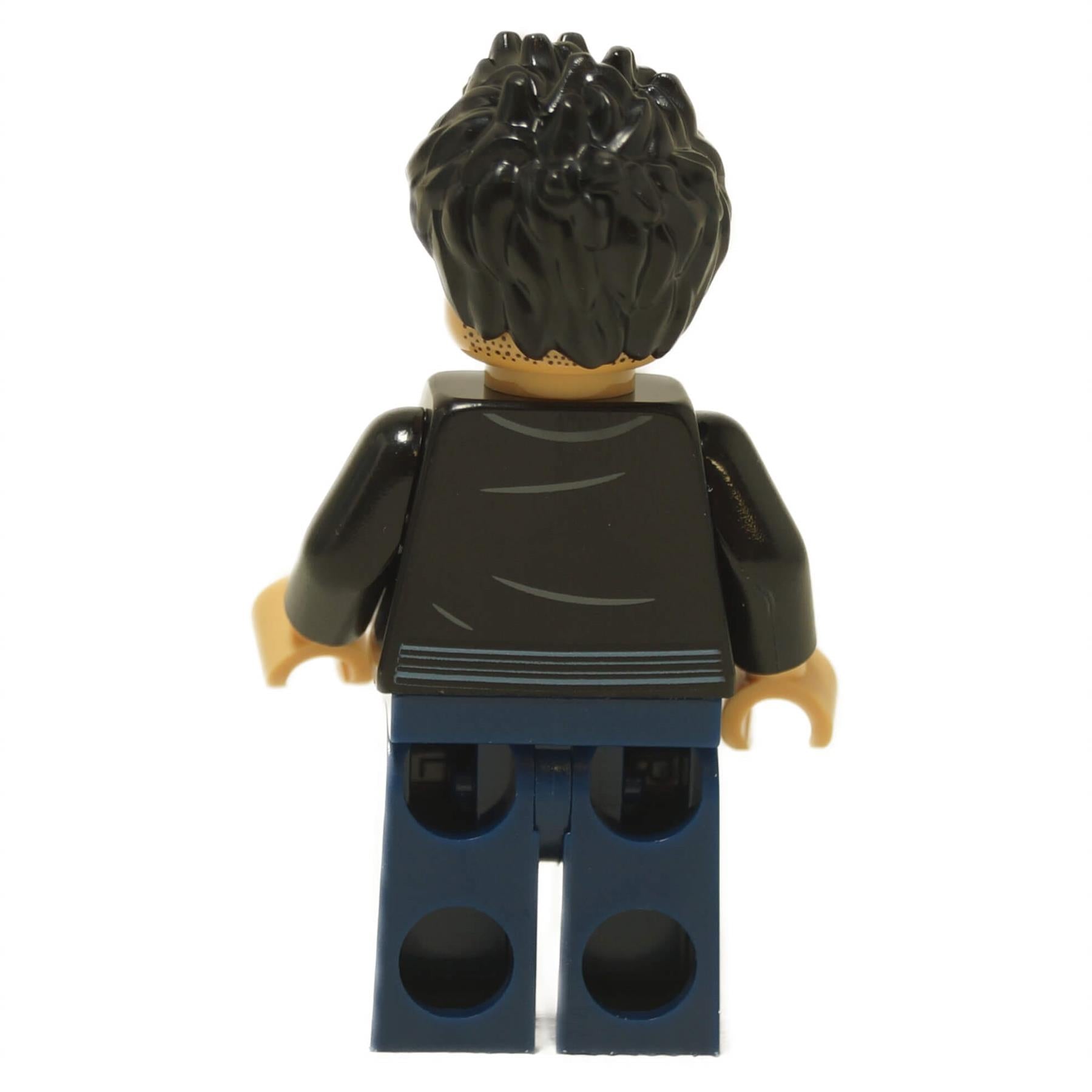 Back view of LEGO® Xavier Dobbs minifigure (jw133) showing printed jacket details and dark blue legs from Jurassic World: Chaos Theory.